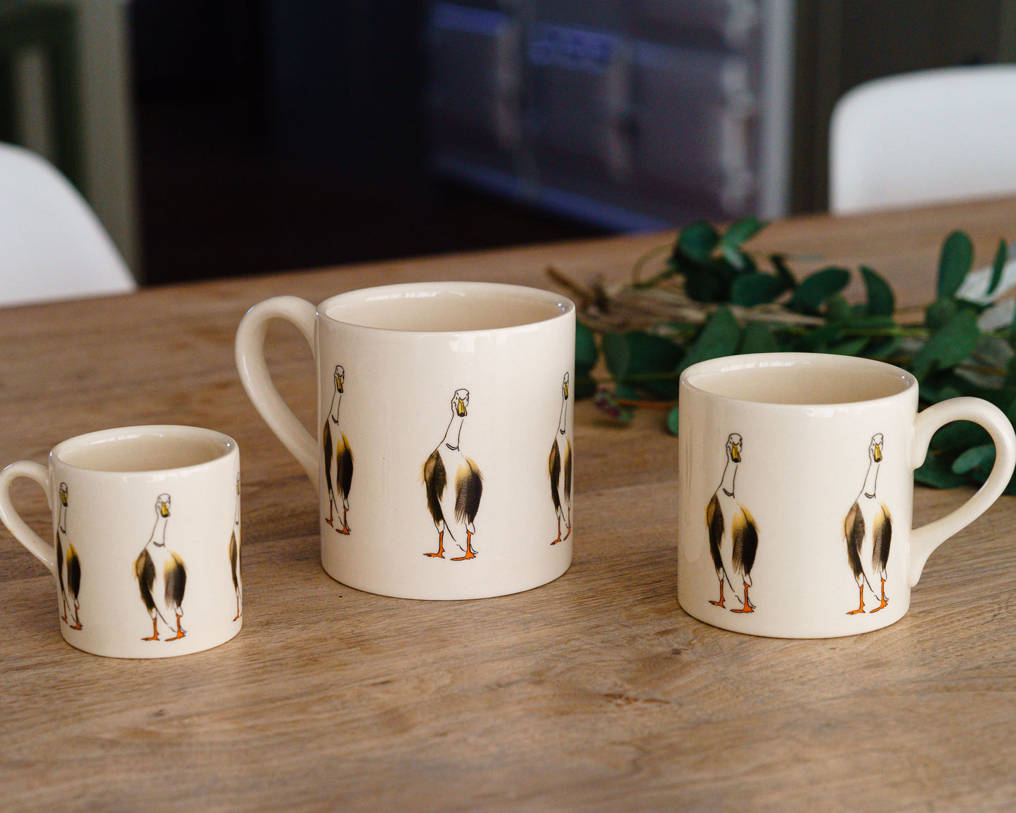 runner duck mugs on kitchen table