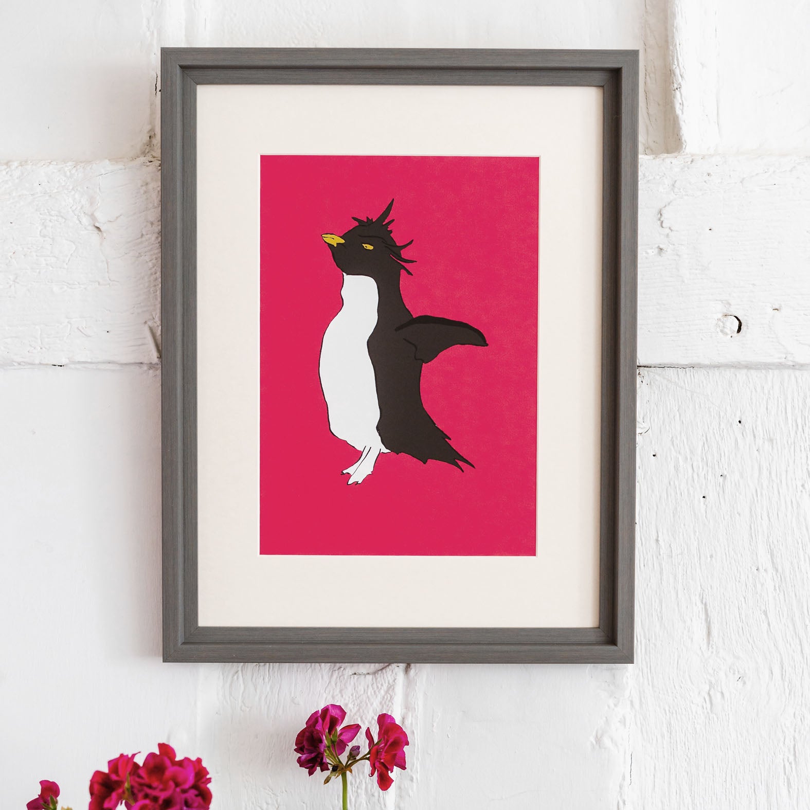 giclee print of a rockhopper penguin with a pink background