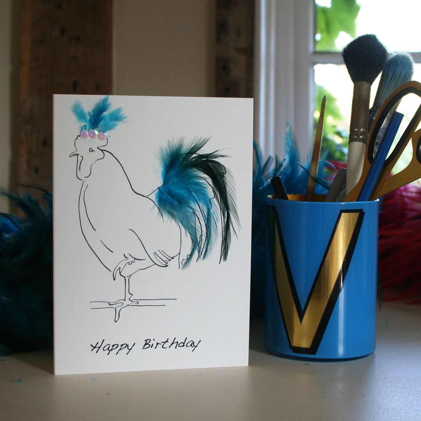 Hen card with real feathers in blue