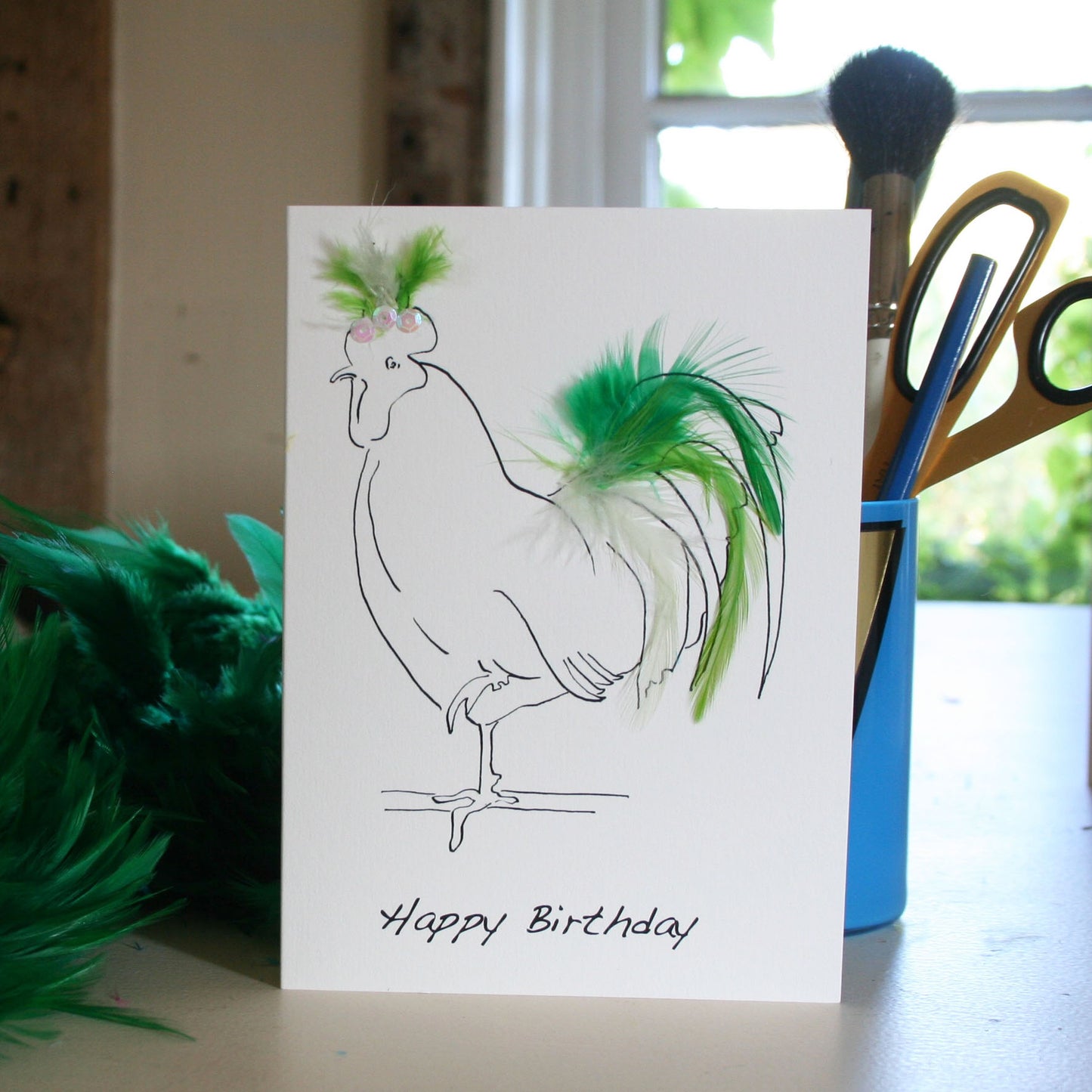 Hen birthday card with real feathers in green
